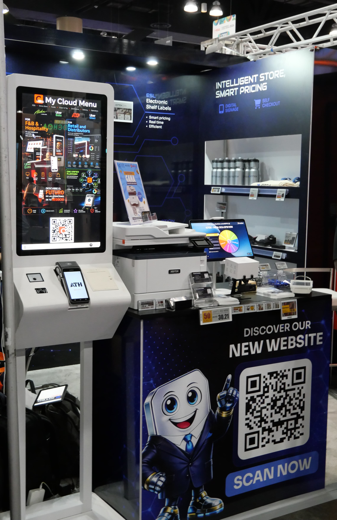 iOTEK Smart Store booth with the ESL-equipped shelf, My Cloud Menu kiosk, and Intelligent Store signage